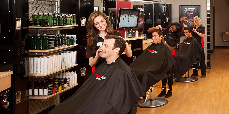 Stylists cutting hair of Clients in Sport Clips Salon